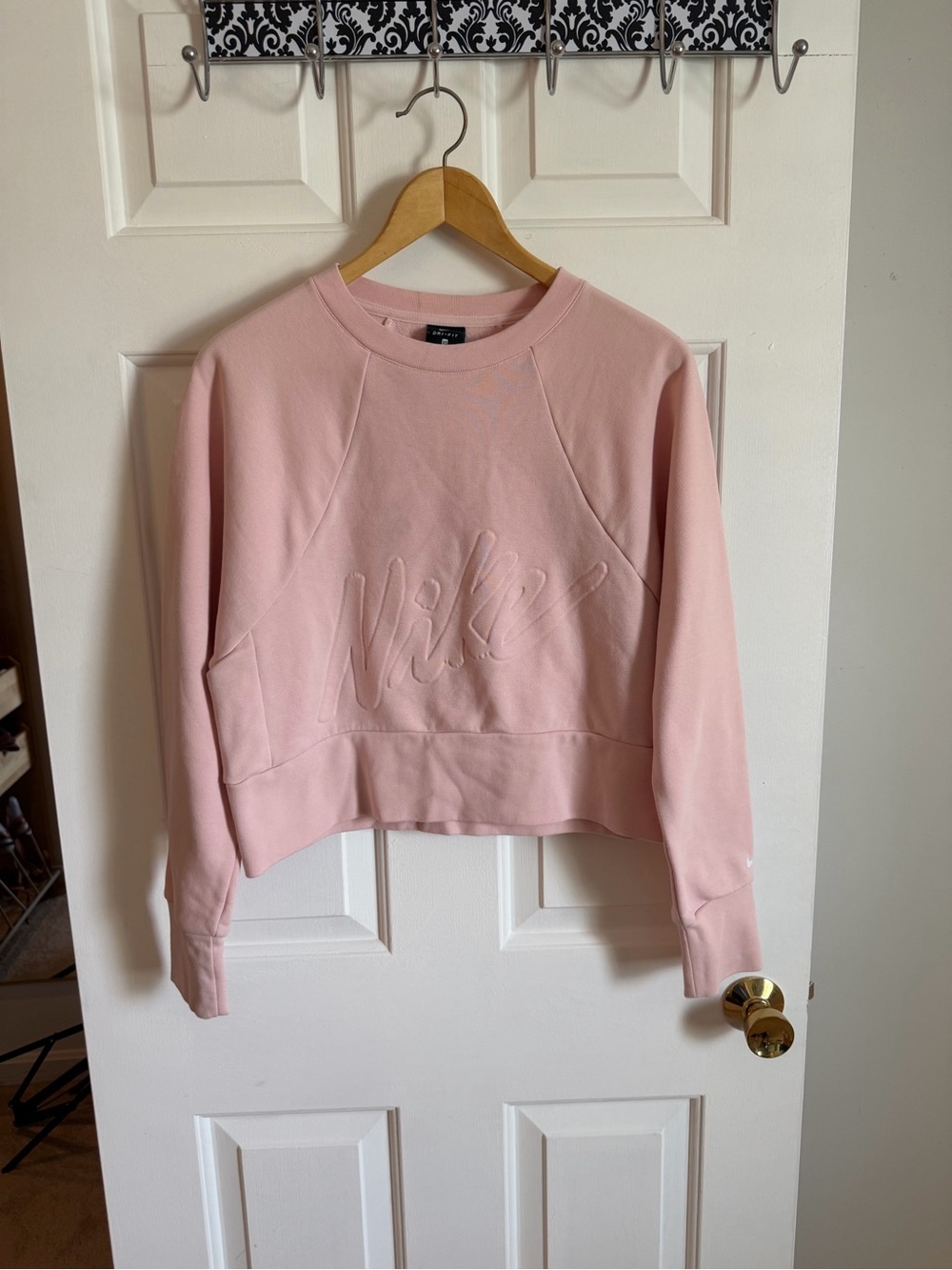 Nike Women's Light Pink Embossed Logo Crew Cropped Sweatshirt